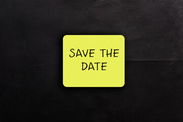 Save the date sticker on a black background