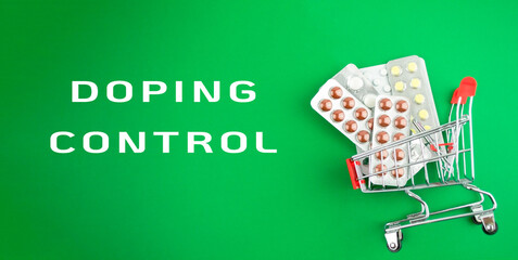 A cart full of pills is on a green background with the words Doping Control