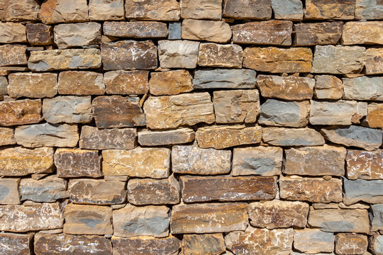 Block brick wall close up patterned background