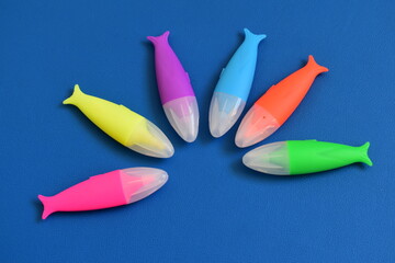 markers on a blue background