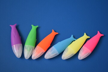 markers on a blue background