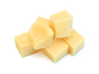 Cubes of cheddar cheese isolated on white