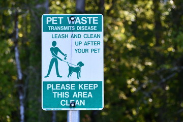 Pet waste station sign. Reads: Pet waste transmits disease.