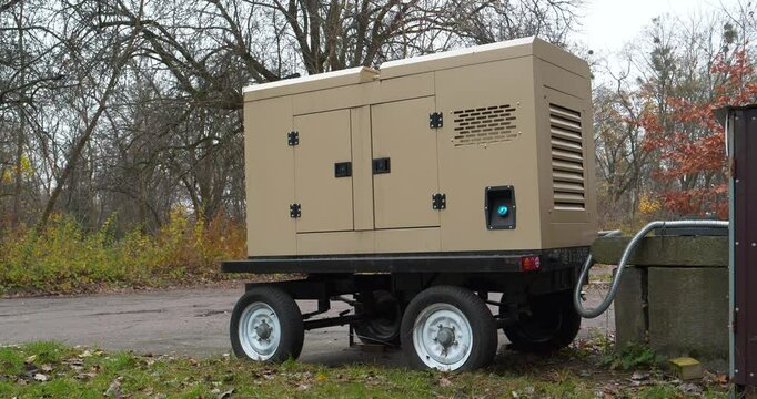 Mobile trailer diesel powered generator with four wheels. Source of electric energy. Mobile trailer type power station is an independent, complete power generation device and system