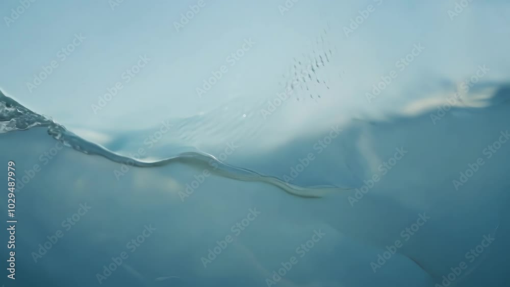 Aufkleber Sunlight reflecting on the surface of a body of water creating abstract shapes with air bubbles visible below the surface
