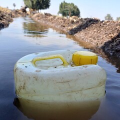 A jerry can immersed in water