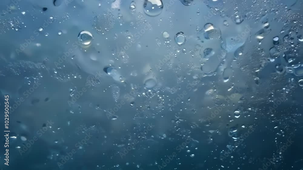 Aufkleber Capturing stunning water droplets forming abstract patterns against a vibrant blue background. Delicate texture and liquid nature create a captivating visual