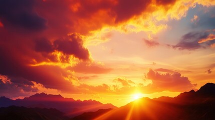 Breathtaking sunset over mountains, vibrant sky with dramatic clouds.