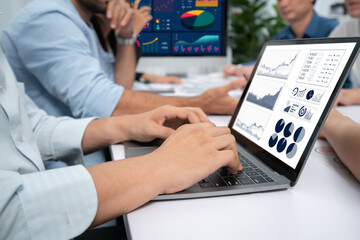 Analyst team uses BI Fintech display laptop to analyze financial data . Business people analyze BI...