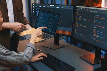 Serious of IT developers discussing intelligent website development coder system running data...