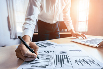 Businessman accountant or financial expert analyze business report graph and finance chart at corporate office. Concept of finance economy, banking business and stock market research. uds