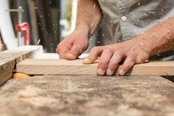 Milling of oak glued board and flying chips and dust