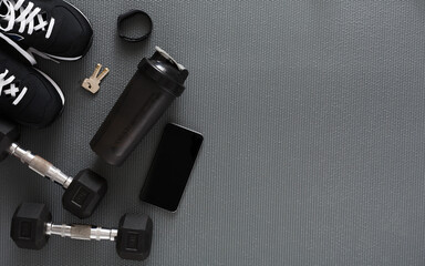 Fitness flat lay background, male sport equipment for training and outfit, copy space. Weightloss, healthy lifestyle concept