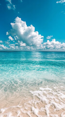 Peaceful Tropical Shoreline with Azure Sky and White Sand