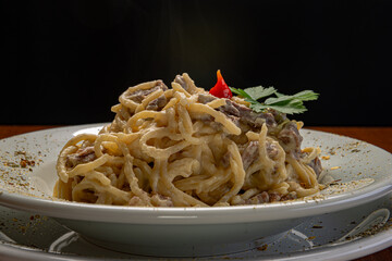 Spaghetti with four cheese sauce and filet mignon