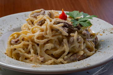 Spaghetti with four cheese sauce and filet mignon