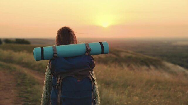 girl with backpack traveling at sunset, hiking person, lidi adventure nature, a girl with a backpack travels at sunset, evening wanderlust, discovering under the sunset, embracing the magic hour