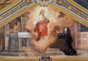 VOGHERA, ITALY - SEPTEMBER 12, 2024: The ceiling fresco of Apparition of  Divine Mercy of Jesus to Faustina Kowalska from side nave of Domo - Collegiata di San Lorenzo by Luigi Morgari (1906 - 1908).