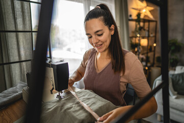 Adult woman work with measuring tape make a new clothes at home