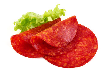 Spanish pork chorizo sausage slices, close-up, isolated on white background.