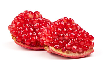 Fresh pomegranate with half sliced open showing seeds, isolated on white background.