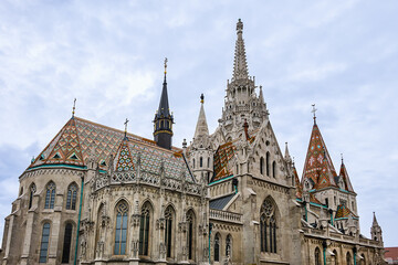 Fototapeta premium Matthias Church (Church of Our Lady of Buda Castle) - Roman Catholic church in Fisherman's Bastion - one of the landmarks of Budapest city. Budapest, Hungary.