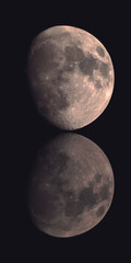 Gibbous Moon on Black Background with Reflection