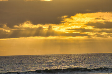 Glorius golden sky during a sunset in Kihei on Maui.