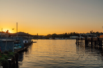 sunset in the harbor with seaplane landing, Lake Union, Seattle