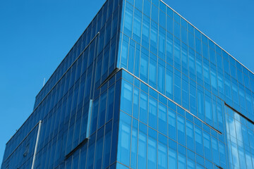 Obraz premium Office building on a background of the blue sky, business complex, headquarters building of a large corporation