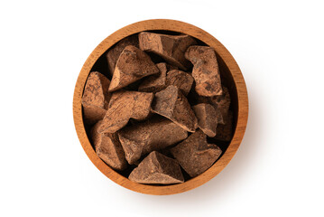 Wooden bowl of cocoa mass isolated on white background. Top view