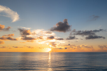 Cloudy sky on sea sunset, sunrise on ocean beach. Sunset landscape in the sky after sunset. Sunrise with clouds of different colors against the sky and sea.