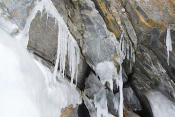The freezing of the water in Lake Baikal has created ice caves in the rocks around Olkhon Island. This landscape only exists from mid-January to early April. Located at Irkutsk Oblast , Russia.