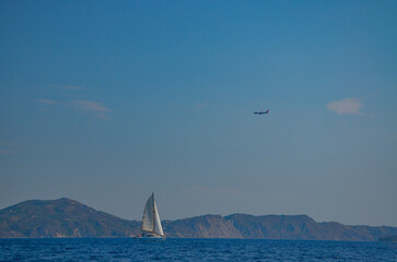 Zakynthos August 2024, amazing multicolored and surprising landscapes and a floating ship on the sea