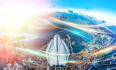 An aerial view of Hong Kong's skyline with vibrant light trails streaking across the cityscape.