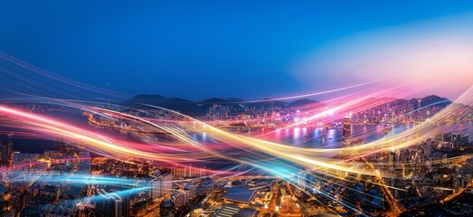 Vibrant light trails illuminate Hong Kong's cityscape at night.