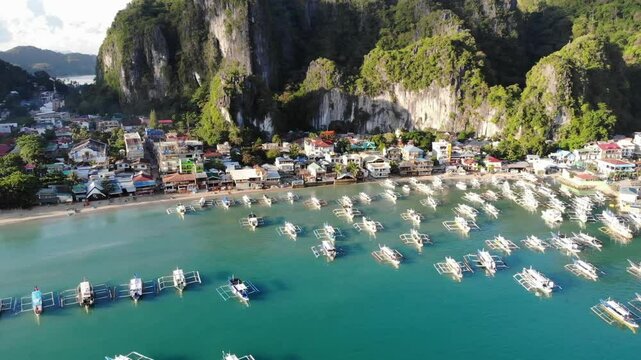 Drone footage captured on morning in May showing the city area, islands, mountains, beaches, and boats in the refreshing sunlight at El Nido, a hidden paradise in Palawan Island, Philippines.