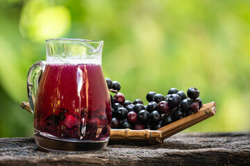 Antidesma puncticulatum Miq.,fruits and extracts on natural background.