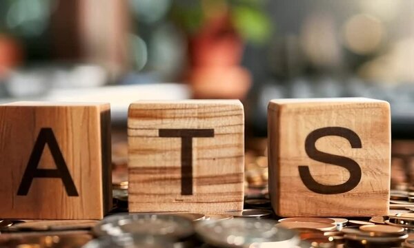 Letters spelling 'ATS' on wooden cubes, arranged to create a clear and tactile representation of the acronym or word
