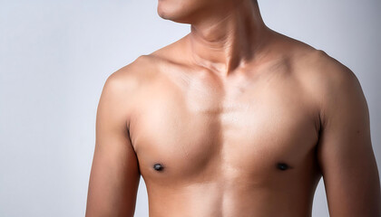 A close-up view of a fit male torso showcasing smooth skin and defined muscles against a neutral background.