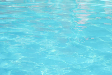 Clear water in outdoor swimming pool on sunny day