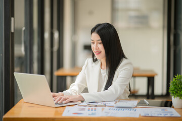 businesswoman working on laptop computer