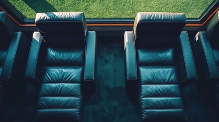 Obraz premium Overhead view of luxurious leather stadium seats near the field, modern and elegant design, showcasing exclusive sports viewing for VIP ticket sales brochures