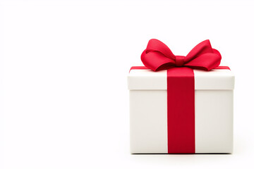 Obraz premium Elegant White Gift Box with Red Ribbon for Celebrations and Special Occasions