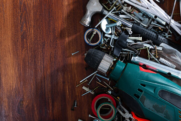 Construction tools and materials on wooden background, repair maintenance concept. Copyspace