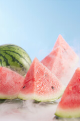 Close-up of cut watermelon on water, chilled watermelon, cool summer atmosphere