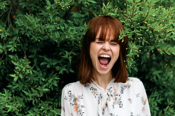 Sensory overload woman captivated by lush greenery, mouth agape in wonder
