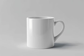 Fototapeta premium A plain white mug with a handle, on a white background.