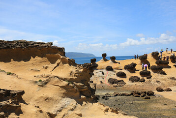 Tourists at Yehliu Geopark, Taipe, Taiwan - August 2, 2019: Due to natural erosion and weathering,...