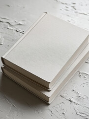 Minimalist White Book on Textured Surface
